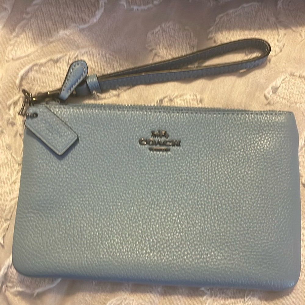 Coach wristlet w/ zip top closure. Blue color    Barely used